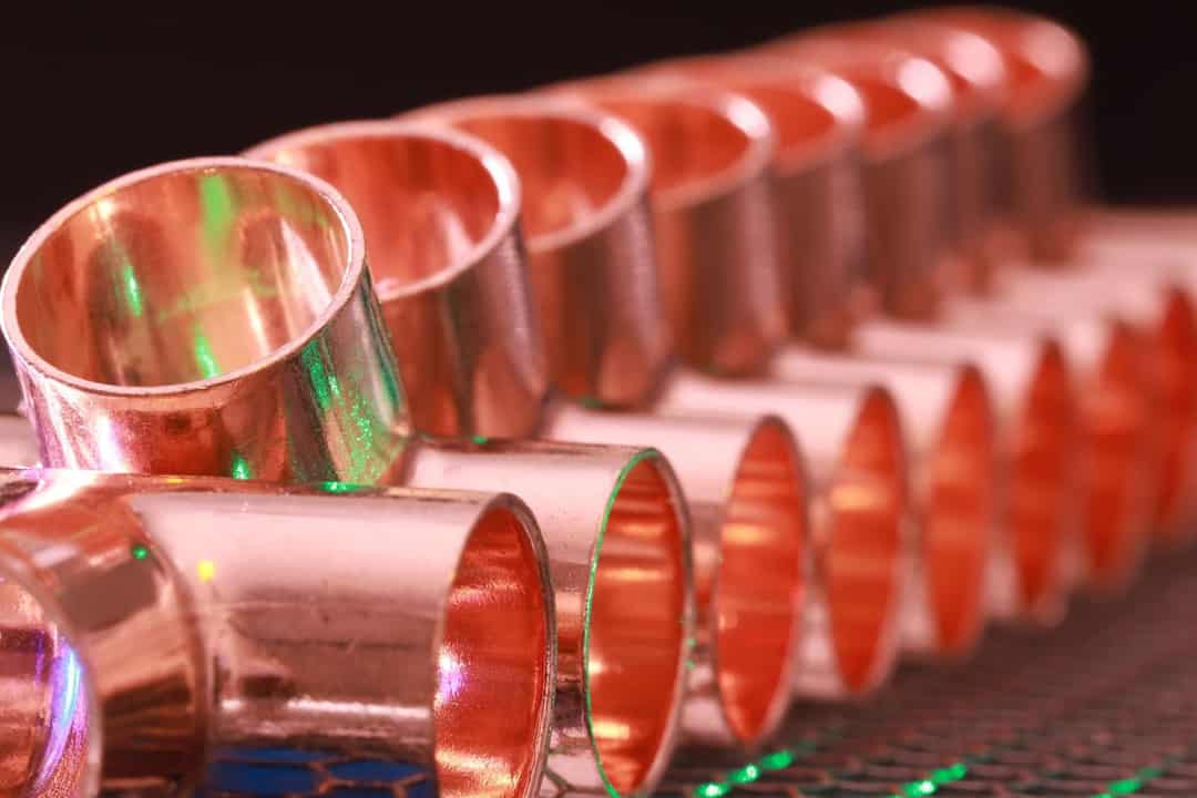 Row of copper pipe fittings