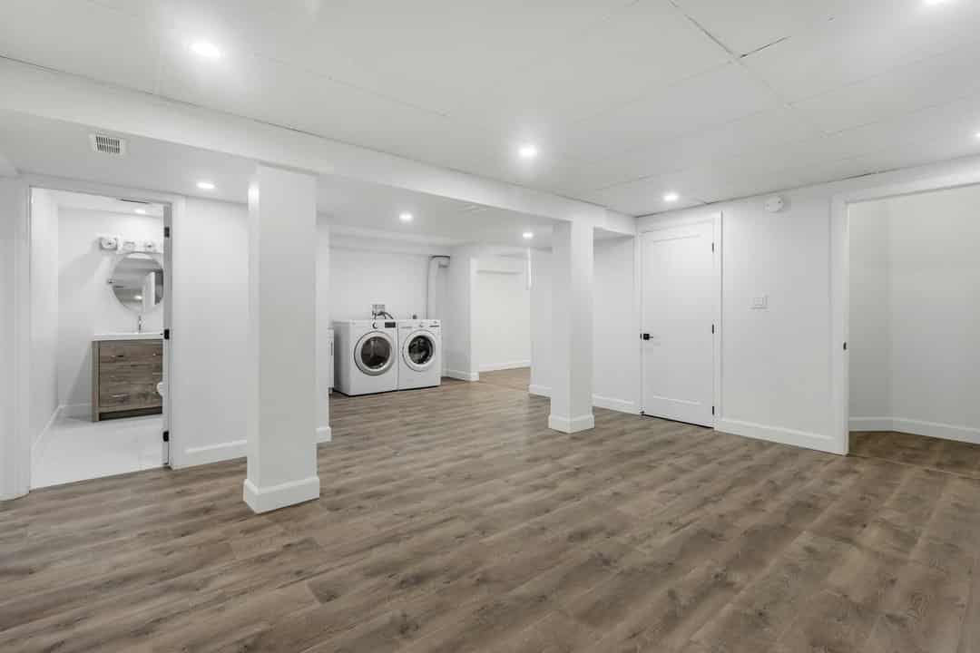 Finished basement with a washer and dryer