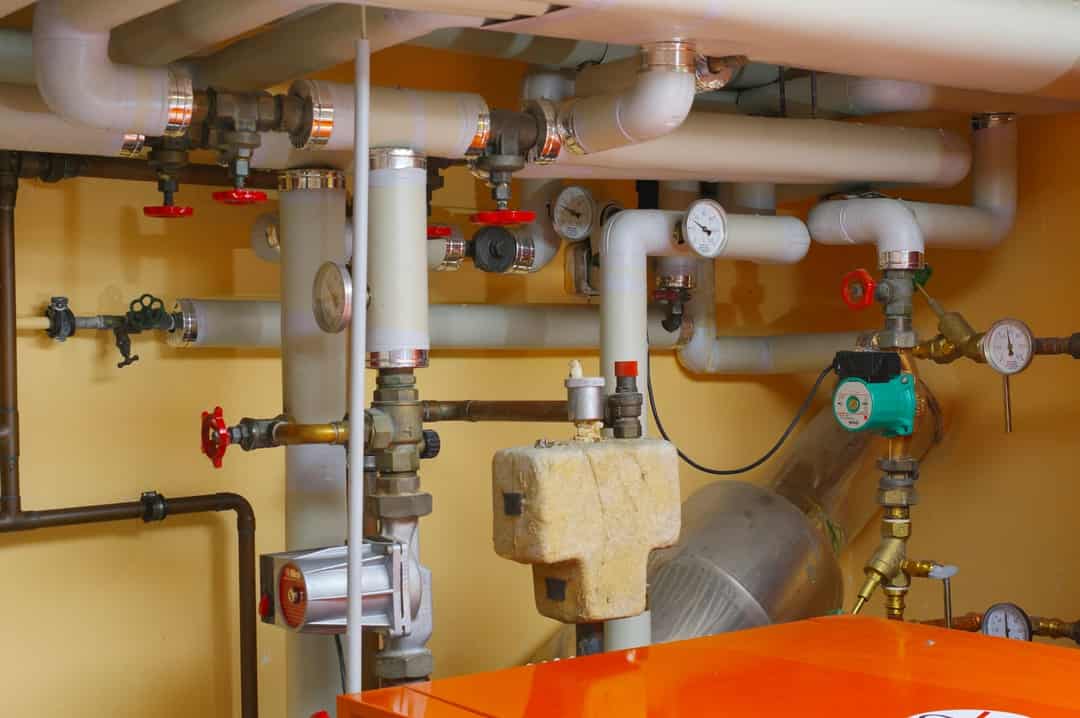 Water pipes and shutoff valves in a utility room