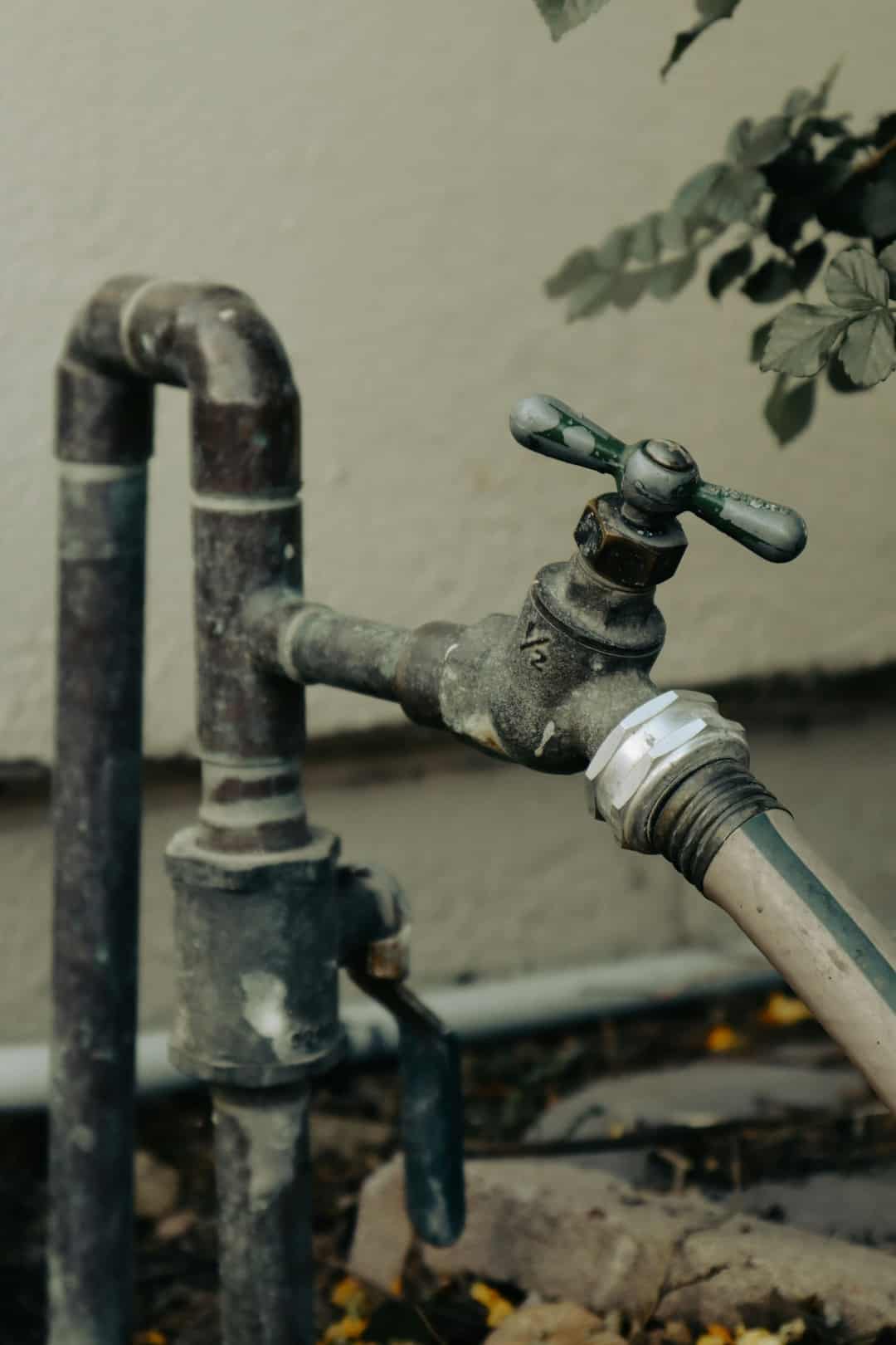 Outdoor spigot with a hose connection on an exposed pipe