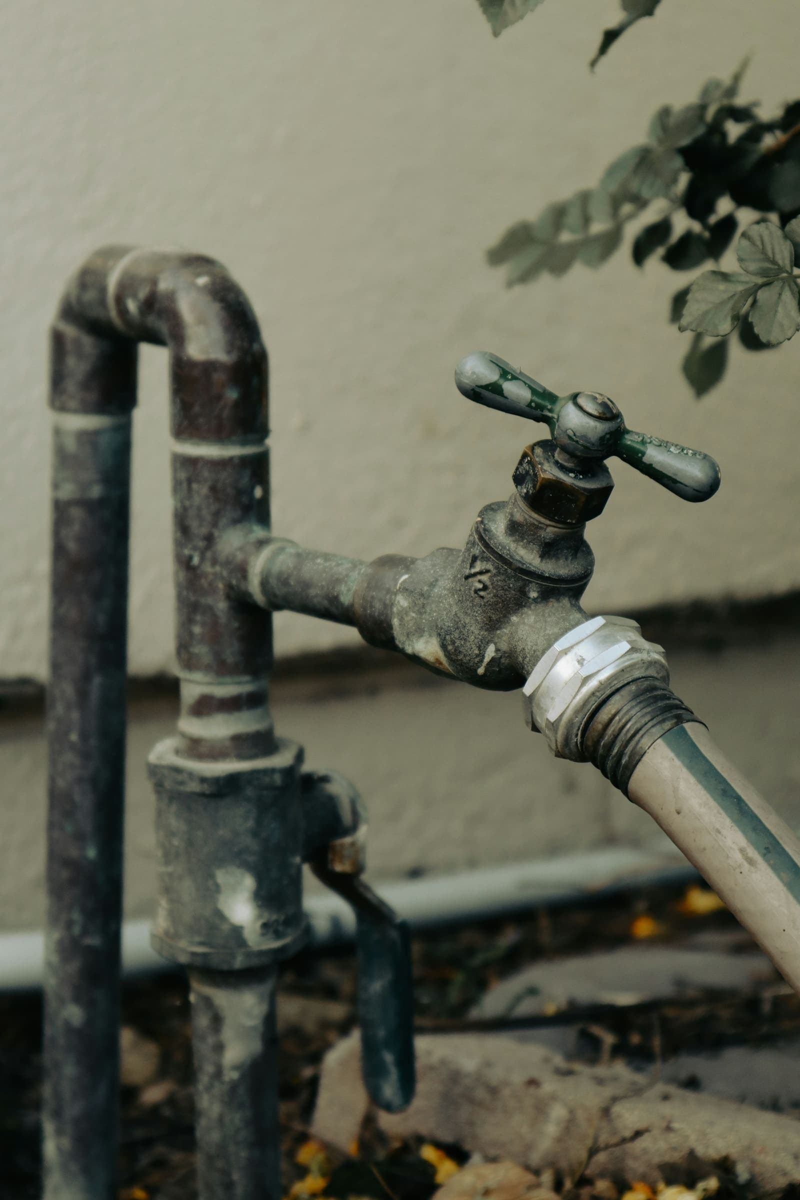 Outdoor spigot with a hose connection on an exposed pipe