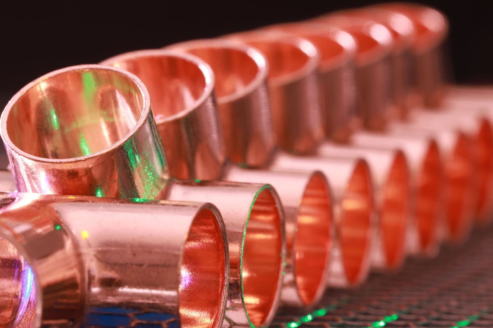 Row of copper pipe fittings