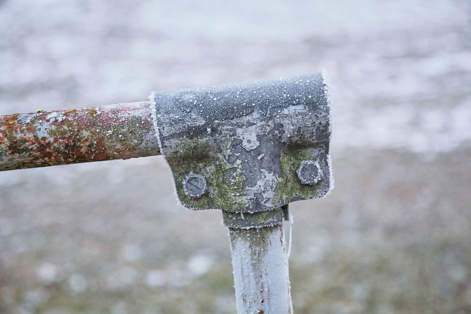 Frost-covered outdoor pipe and fitting